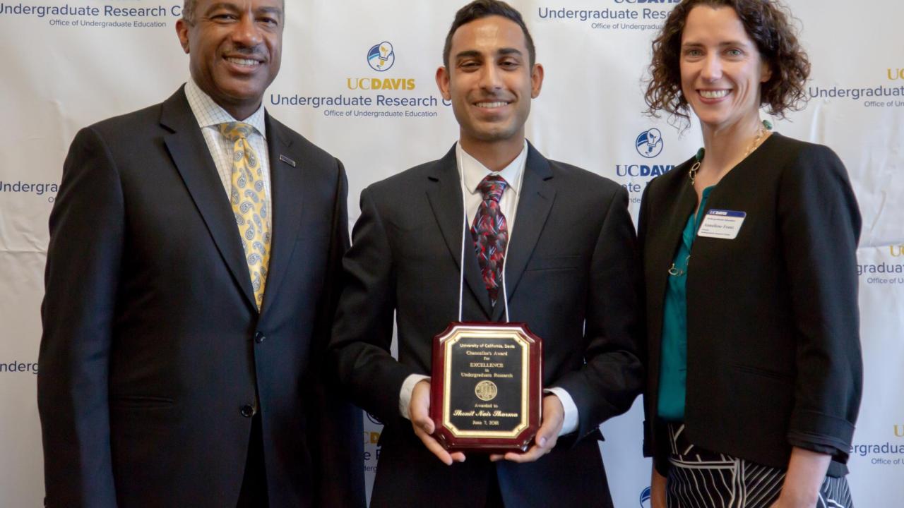 UC Davis 2018 University Honors Program Graduate Shonit Sharma wins Chancellor's Award for Excellence in Undergraduate Research. Left to Right: UC Davis Chancellor Gary May, Shonit Sharma, Undergraduate Research Center Faculty Director Annaliese Franz. UC Davis 2018 University Honors Program Graduate Shonit Sharma wins Chancellor's Award for Excellence in Undergraduate Research