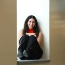 Jumana Esau seated in a window in Shields Library