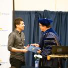 Professor Ryan Finnigan (left) receives the 2019 UC Davis University Honors Program Outstanding Mentorship Award from UHP Associate Director Eddy Ruiz (right)